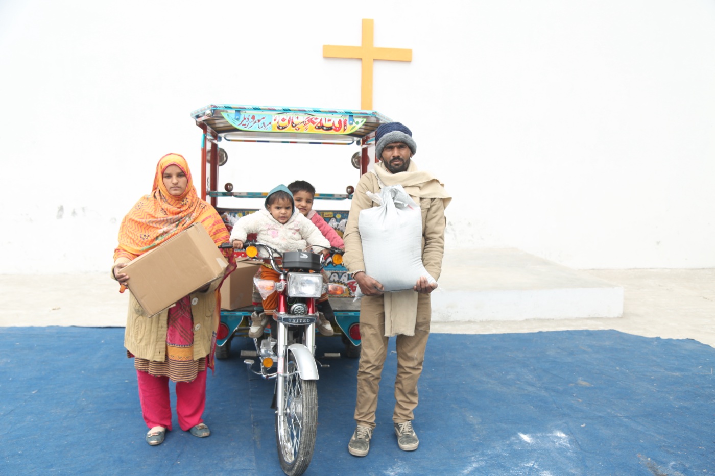Abid Masih and family, freed from a brick kiln, with their Chingchi rickshaw from Good Samaritan Ministries