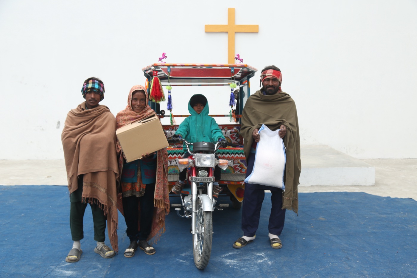 Safdar Masih and family, freed from a brick kiln, with their Chingchi rickshaw from Good Samaritan Ministries
