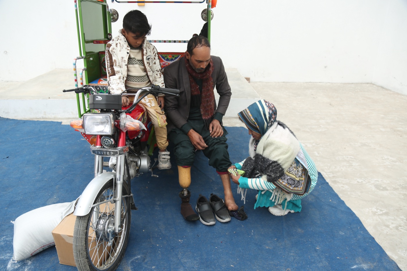 Shahbaz Masih and family, freed from a brick kiln, with their Chingchi rickshaw from Good Samaritan Ministries