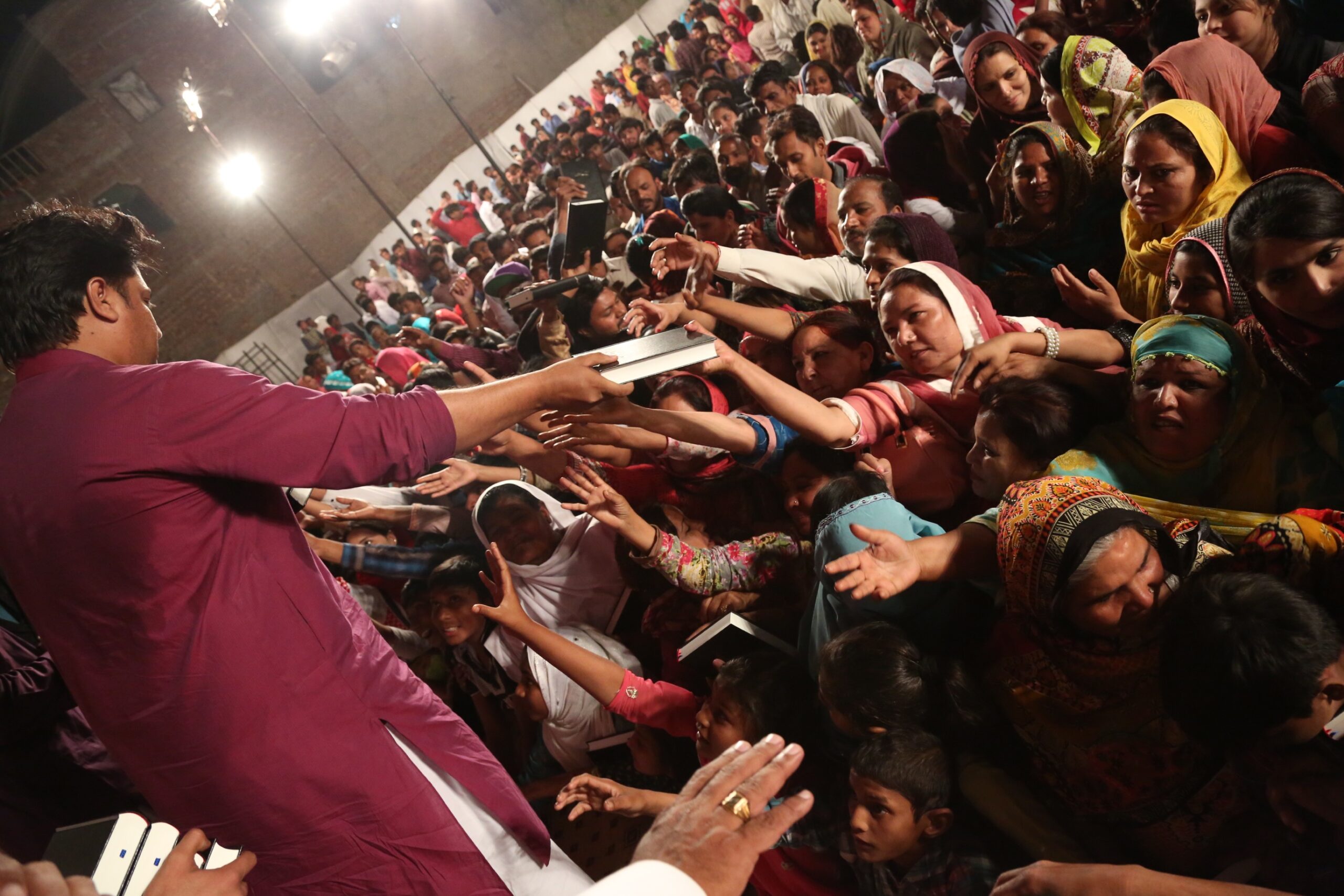 Free Urdu Bibles Distribution in Pakistan During Evangelistic Gospel Crusades.