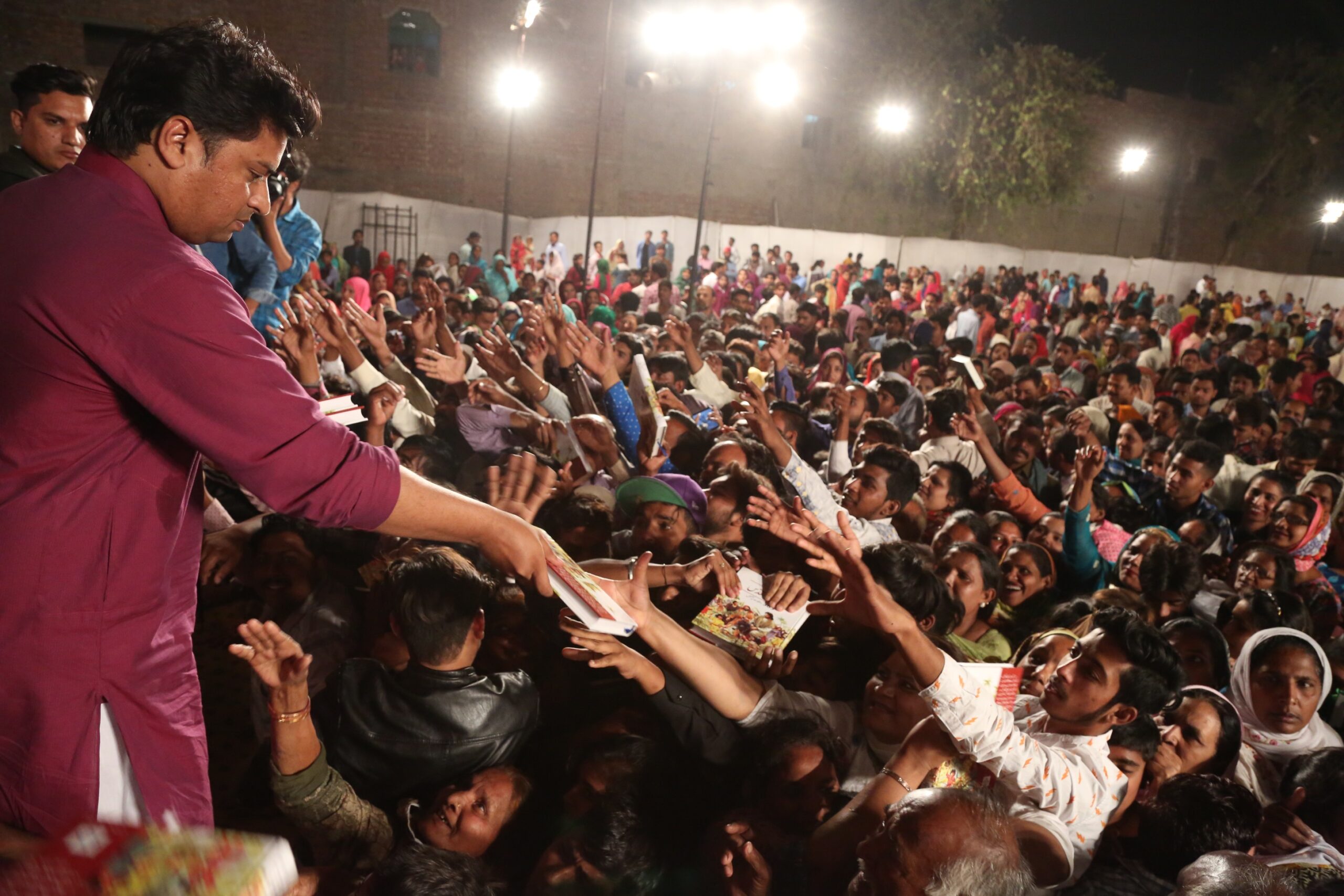 Free Urdu Bibles Distribution in Pakistan During Evangelistic Gospel Crusades.