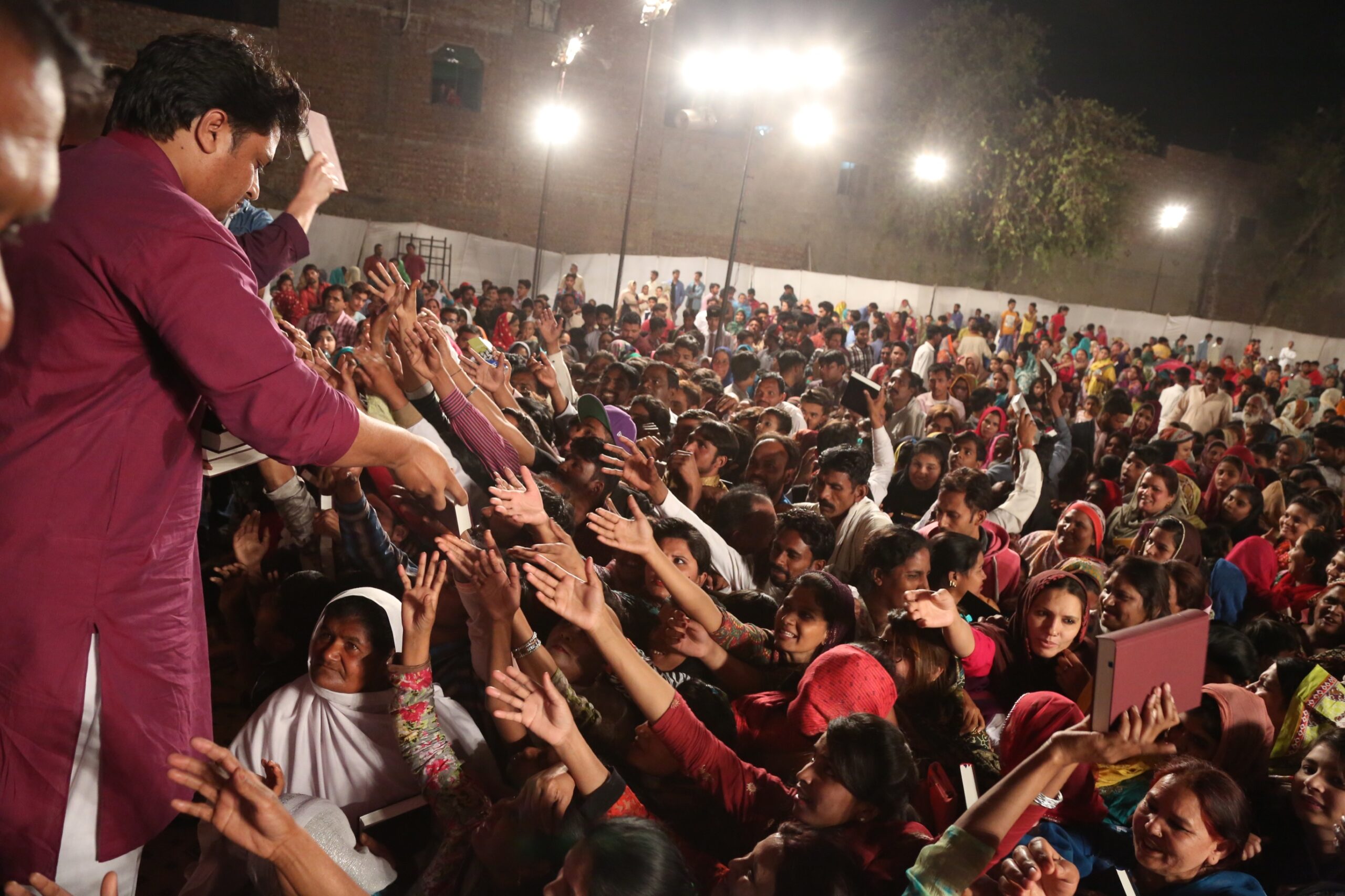 Free Urdu Bibles Distribution in Pakistan During Evangelistic Gospel Crusades.