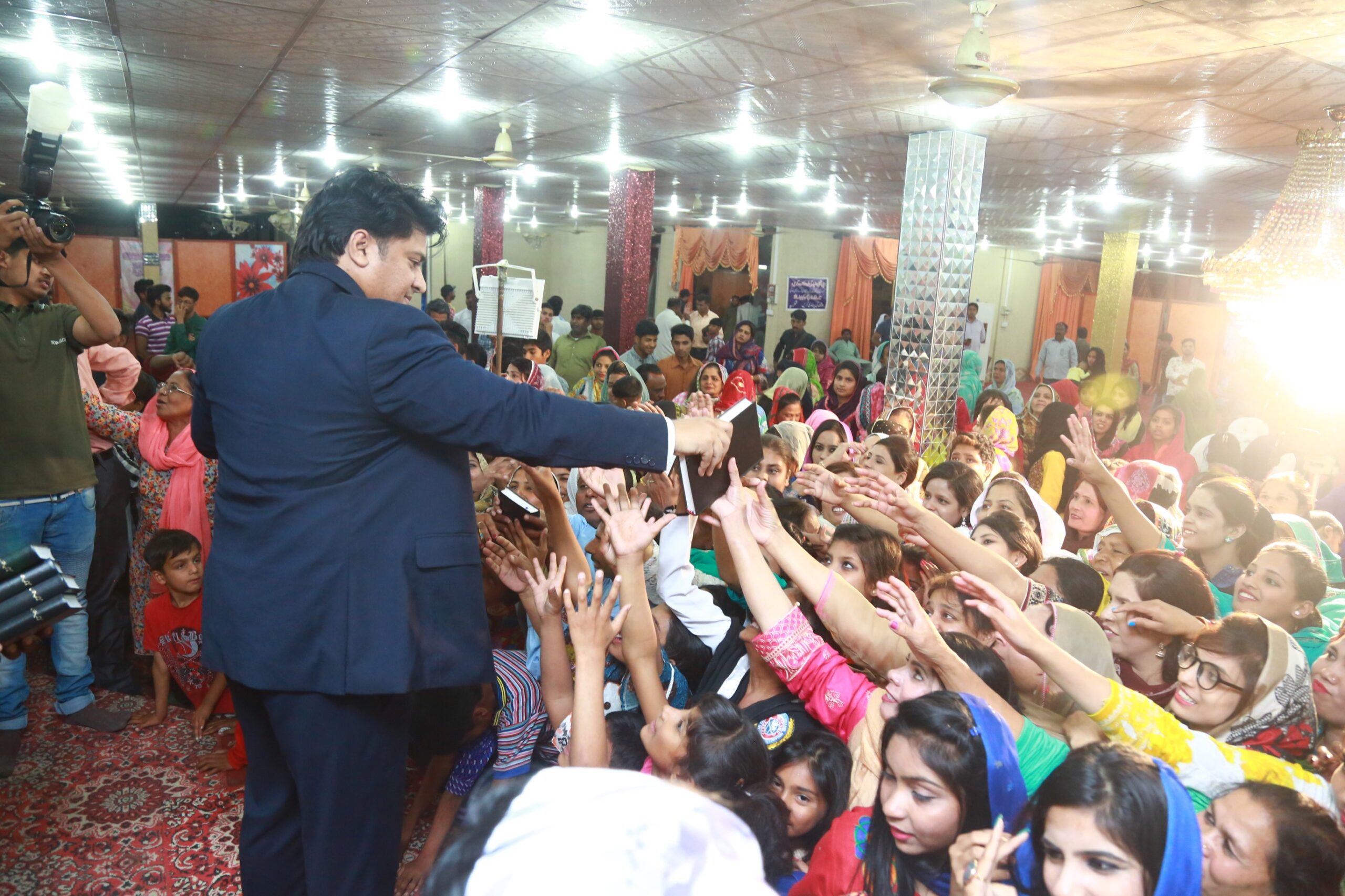 Free Urdu Bibles Distribution in Pakistan During Evangelistic Gospel Crusades.