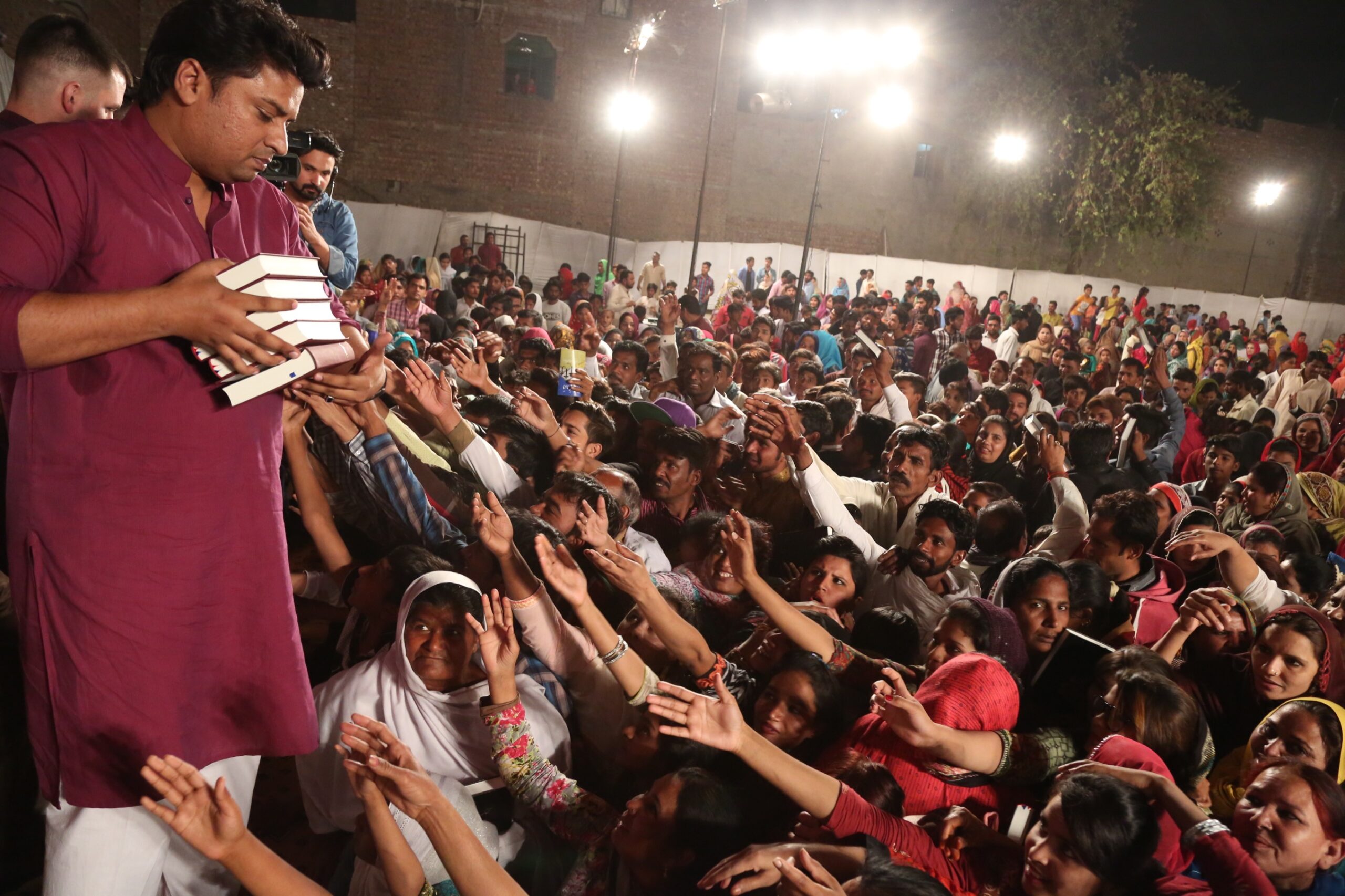 Free Urdu Bibles Distribution in Pakistan During Evangelistic Gospel Crusades.