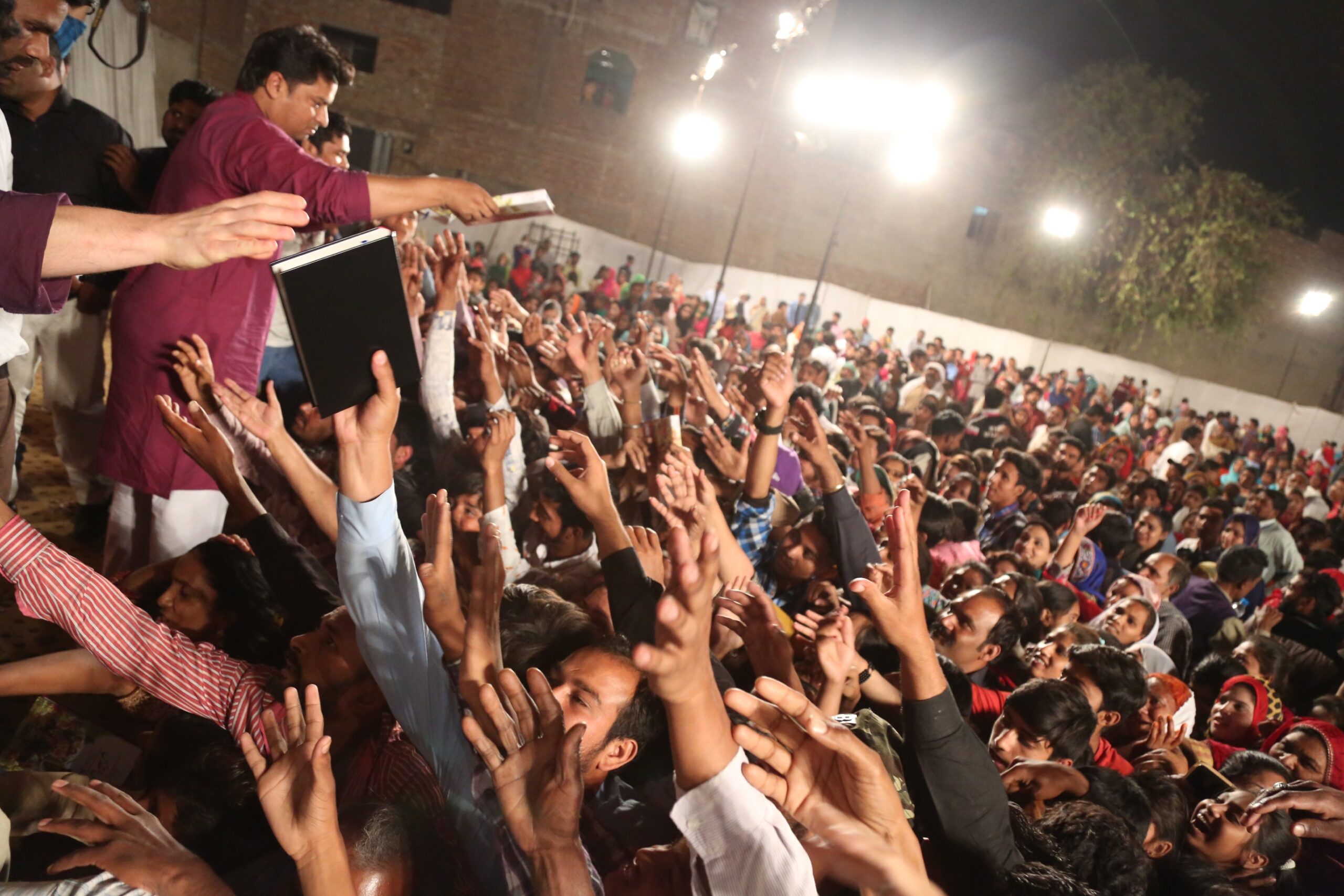 Free Urdu Bibles Distribution in Pakistan During Evangelistic Gospel Crusades.