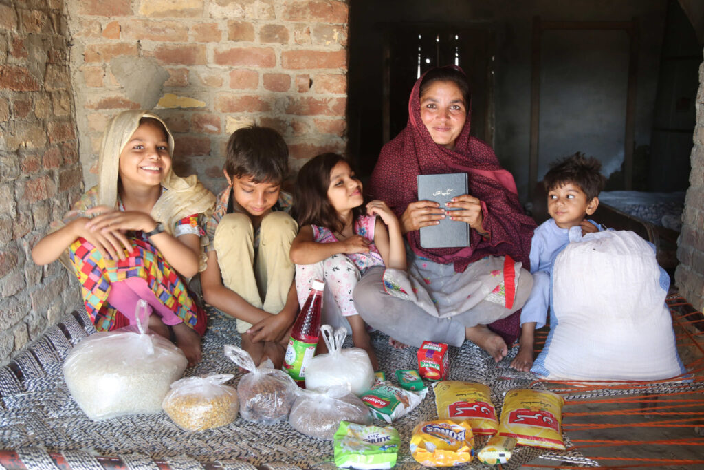 Family food relief package being given in Pakistan